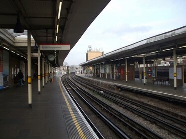 A long eastbound platform and even longer rails view.