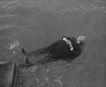 Alfred Hitchcock's very realistically-looking puppet being drowned.