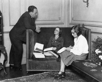 Hitchcock working with Alma, with a mystery never identified secretary by him watching some notes.