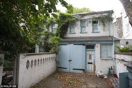 Poor-looking backyard of the Durham Cottage