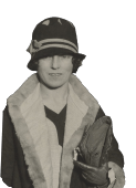 Young Alma Reville in a coat, a hat and with a purse, smiling.